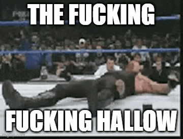 a man is laying on the ground in a wrestling ring with the words the fucking fucking hallow above him