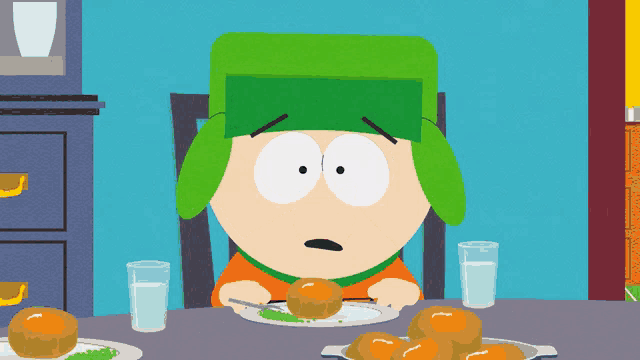 a south park character is sitting at a table with a plate of food and a glass of water