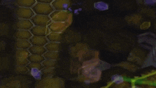 a cartoon character is dancing on a stage in front of a honeycomb .