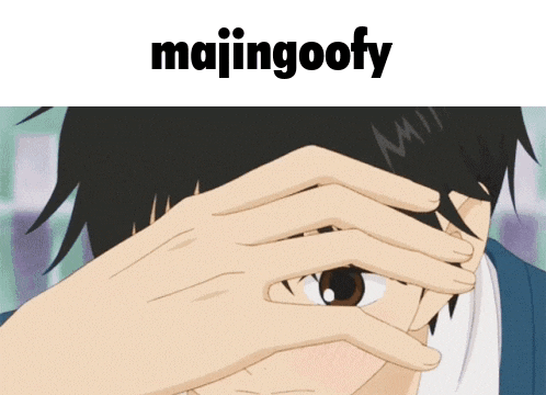 a person covering their face with their hand and the word majingoofy is above them