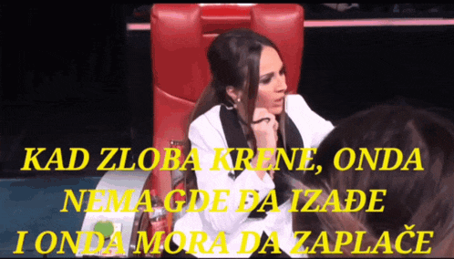 a woman sits in a red chair with the words kad zloba krene on the top