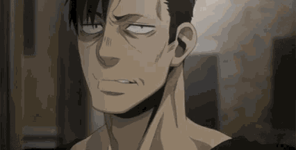 a close up of a man 's face with his eyes closed and a slight smile on his face .