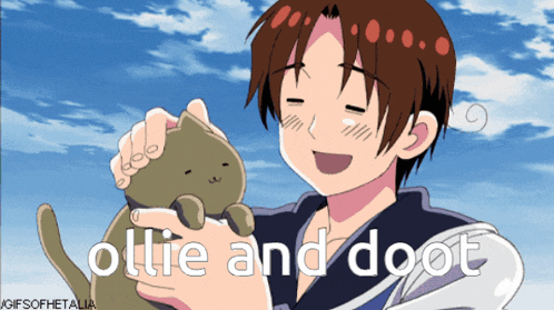 a gif of a boy holding a cat with the words ollie and doot below him