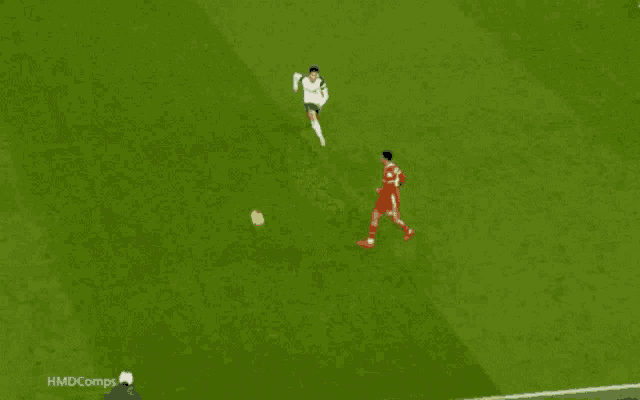 a soccer player wearing a red jersey with the number 66 on it