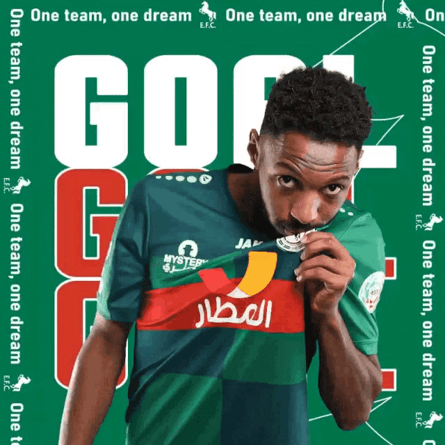 a man wearing a green and red jersey with the word go on it