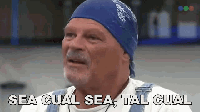 a man wearing overalls and a blue bandana is saying sea cual sea tal cual