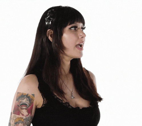 a woman with a tattoo of monkey d luffy on her arm is wearing a black top