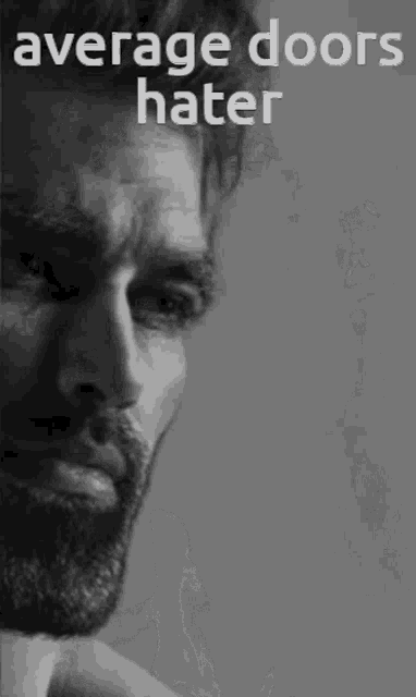 a black and white photo of a man 's chest with the words `` average doors hater '' above him .