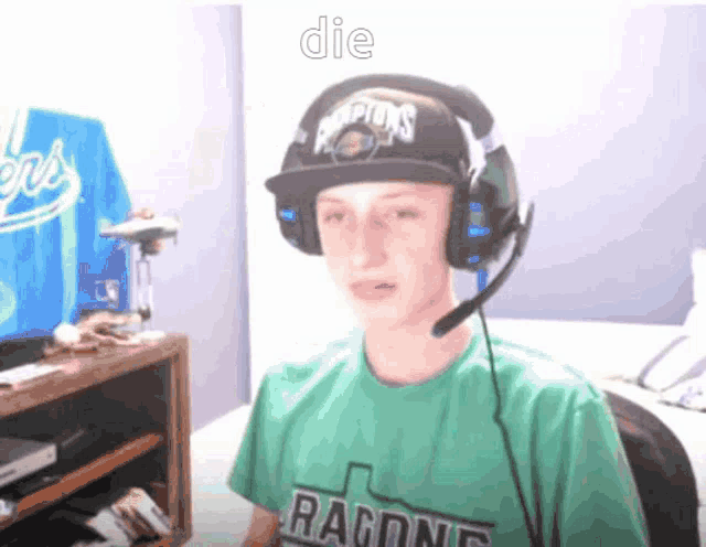 a boy wearing headphones and a hat that says champions on it