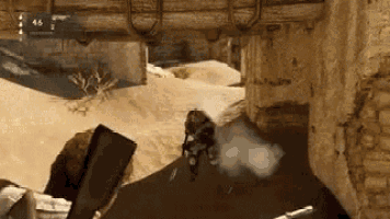 a person is holding a gun in a video game and shooting a gun in the desert .