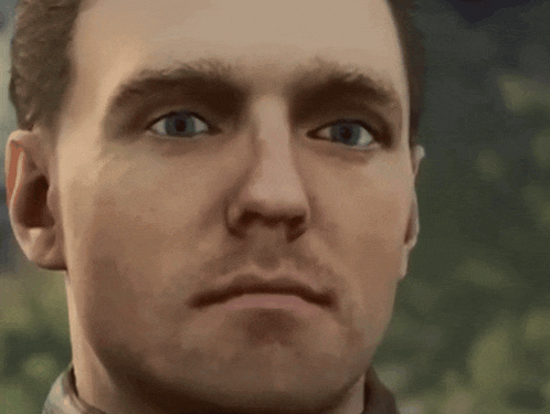 a close up of a man 's face with his eyes closed