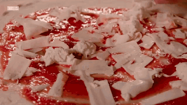 a close up of a pizza with the word thriller written on the bottom