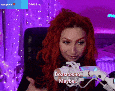 a woman with red hair is sitting in front of a microphone with the words maybe on it