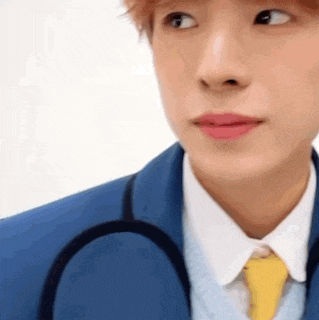 a close up of a person wearing a suit and tie with a stethoscope around his neck .