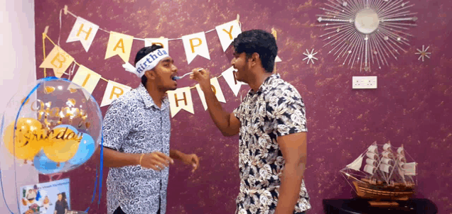 a man wearing a headband that says " happy birthday "