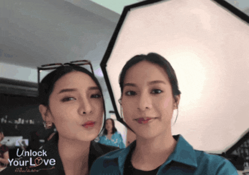 two women are posing for a picture with the words unlock your love on the bottom right
