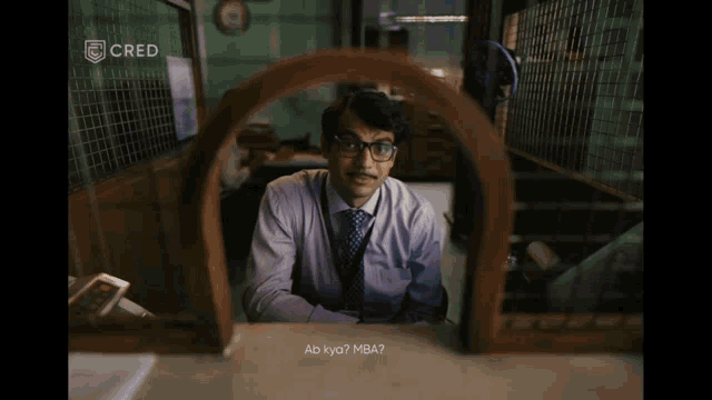 a man with glasses and a mustache is looking through a window with cred written on the bottom