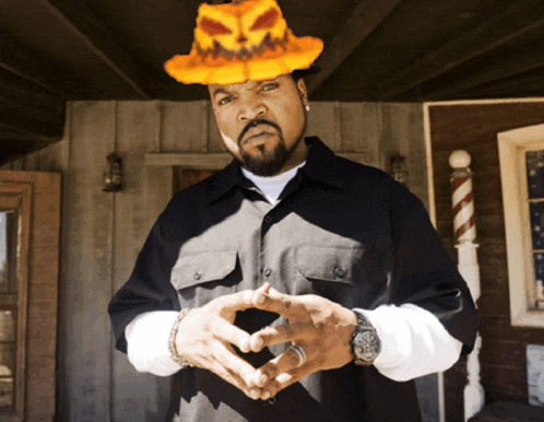 ice cube is wearing a halloween hat with a pumpkin on it