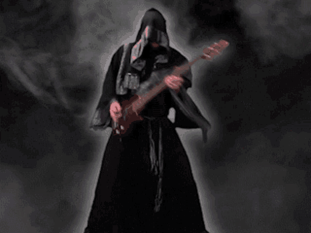 a man in a black robe is playing a red electric guitar