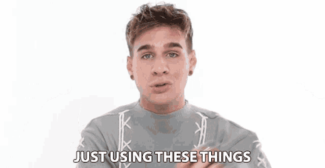 a young man in a grey sweater is talking about just using these things