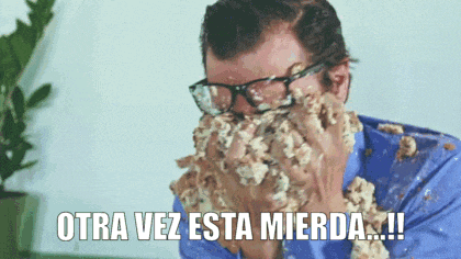 a man with glasses is covering his face with food and says otra vez esta mierda !!!