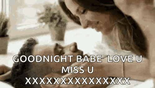 a man and a woman are kissing on a bed with the words `` goodnight babe love u miss u '' .