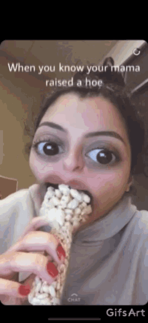 a woman is eating a bar of popcorn with a caption that says when you know your mama raised a hoe