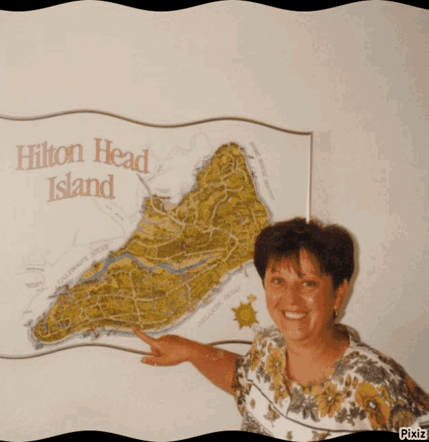 a woman pointing to a map of hilton head island