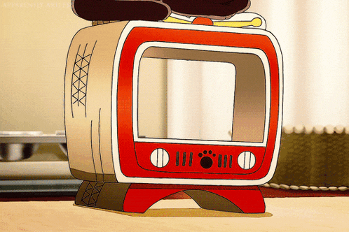 a cartoon character sitting on top of a red and white television