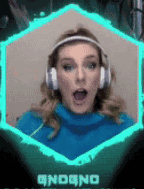 a woman wearing headphones and a blue sweater with the word andono on the bottom right