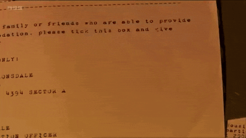 a person is stamping a piece of paper that says leeds on it