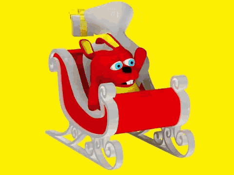 a stuffed animal is sitting in a sleigh with gifts