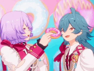 a girl with purple hair is feeding a pink donut to another girl with blue hair