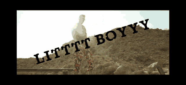 a man is standing on a rock with the words litttt boyyy written above him