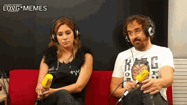 a woman wearing headphones sits next to a man holding a yellow microphone that says love memes on the bottom