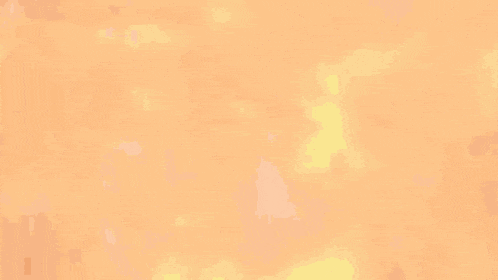a blurred image of a large fire with a lot of flames coming out of it
