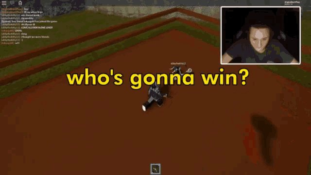 a man playing a video game with the words who 's gonna win on the screen