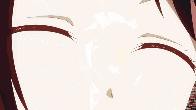 a close up of a girl 's face with a smile on her face