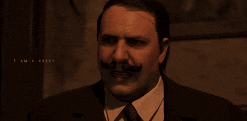 a man with a mustache is covering his nose with his hand and the words i am a creep are below him