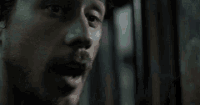 a close up of a man 's face with the words did camila take your balls or what asshole written below him