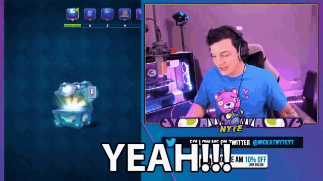 a man wearing headphones and a blue shirt with a teddy bear on it says yeah