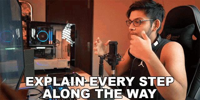 a man sitting in front of a microphone with the words explain every step along the way