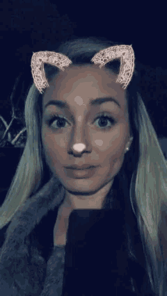 a woman with cat ears on her face