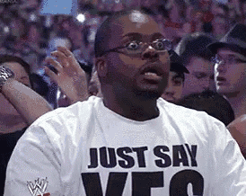 a man wearing glasses and a shirt that says just say veo