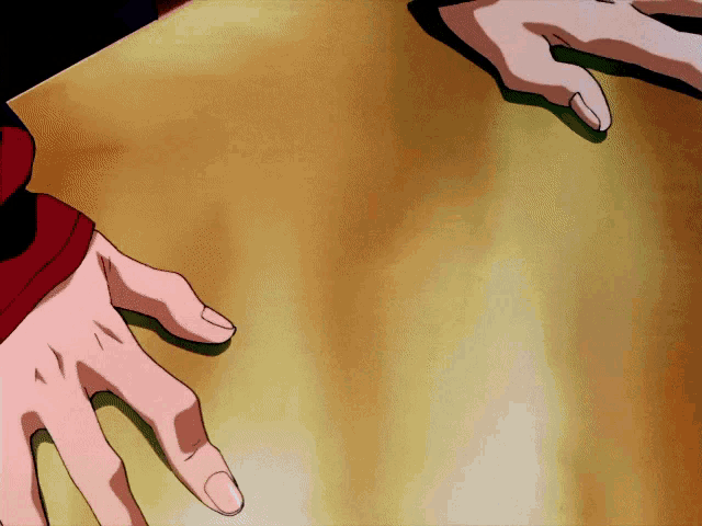 a person 's hands are reaching out towards each other