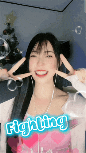 a girl giving a peace sign with the word fighting in the corner
