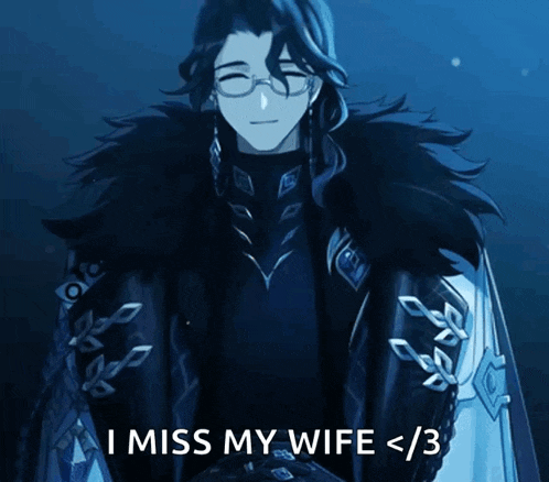 a man in a black coat and glasses says i miss my wife < 3