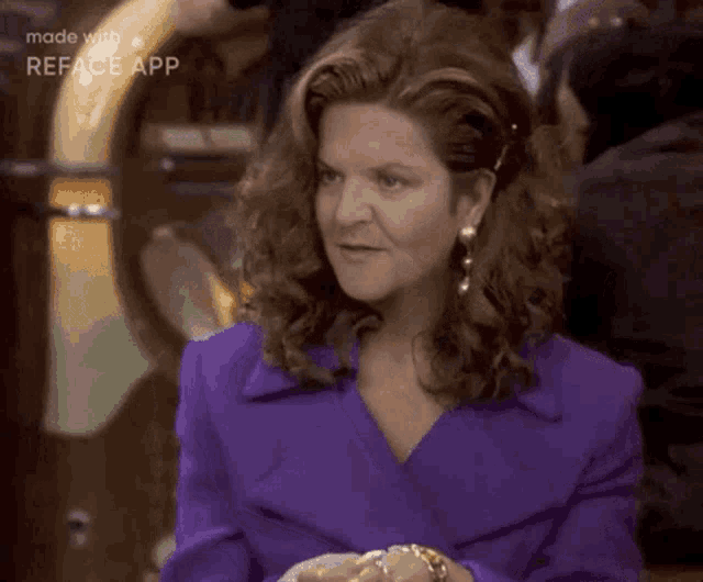 a woman in a purple jacket is making a face with the reface app