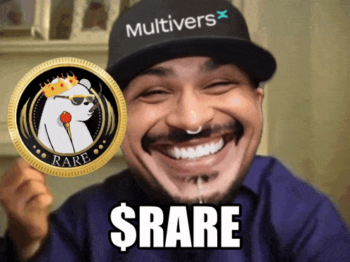 a man wearing a hat that says multivers holds up a rare coin