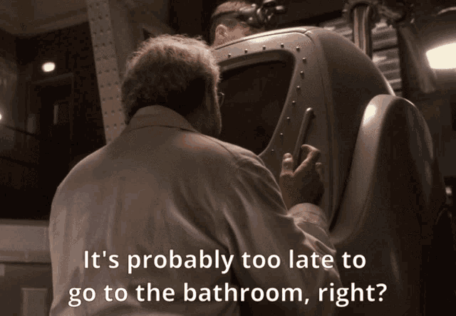 a man in a white shirt says it 's probably too late to go to the bathroom right '